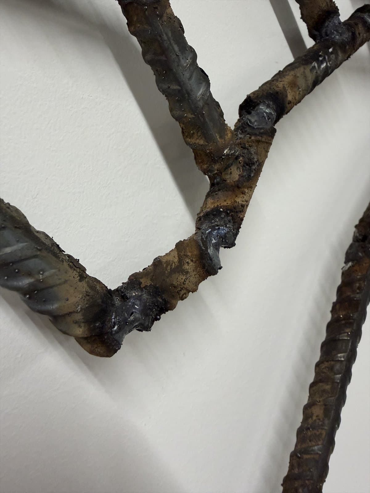 Close view of welded joints in a rebar hand sculpture