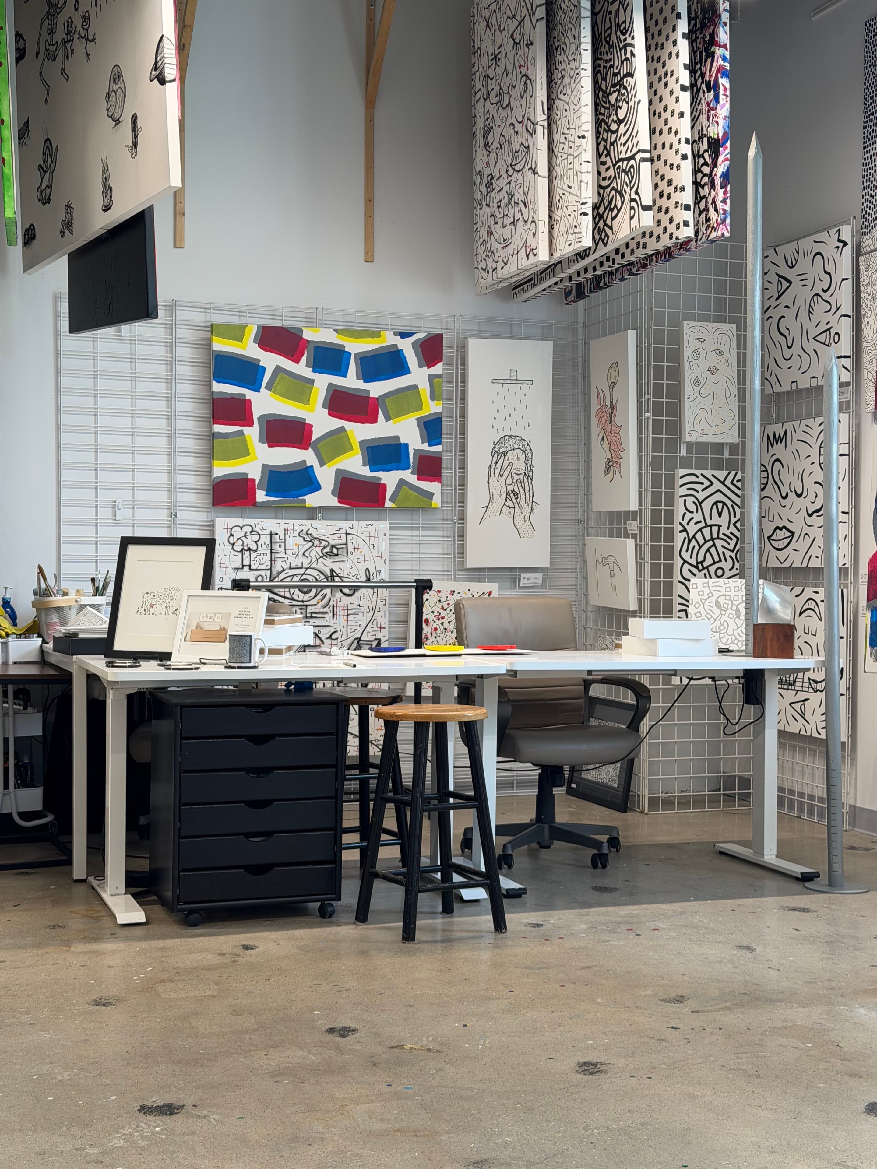 Thomas Goetz's studio with paintings and drawings covering the working walls
