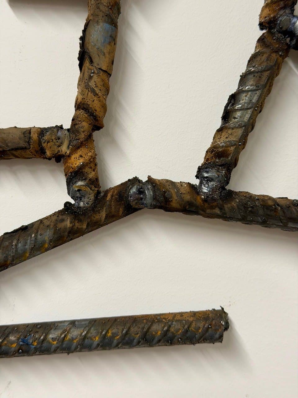 Rebar segments joined to create a drawn line in physical space